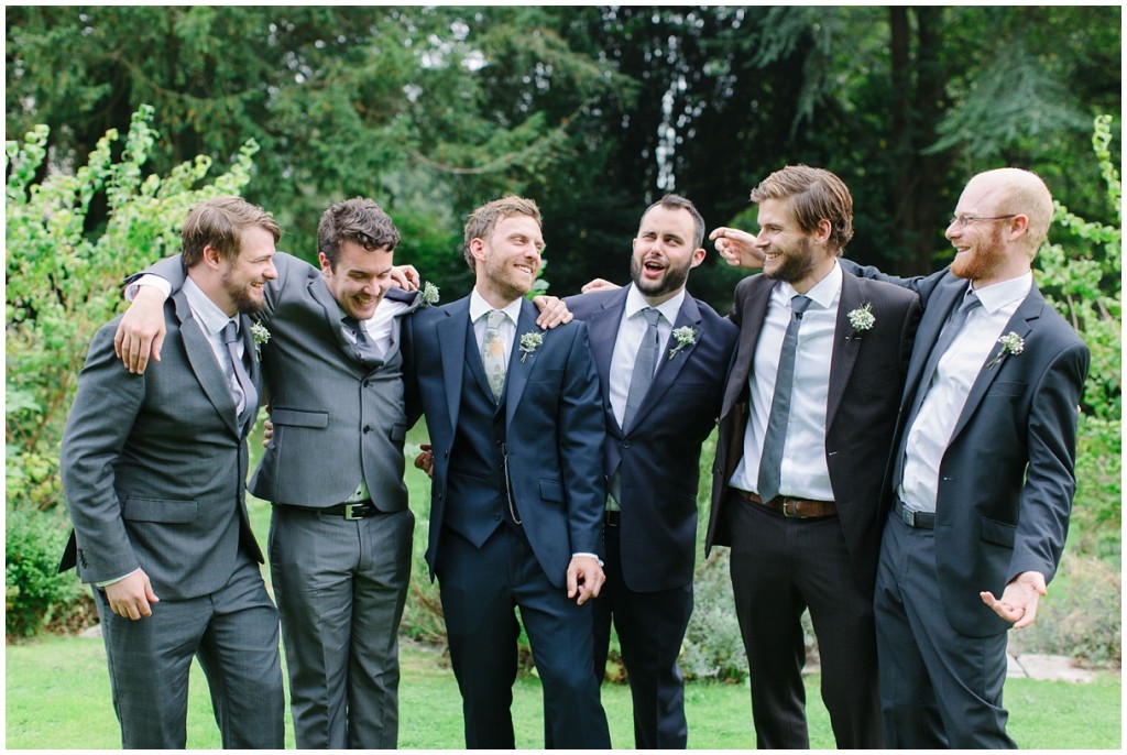 groom and ushers in mismatched suits