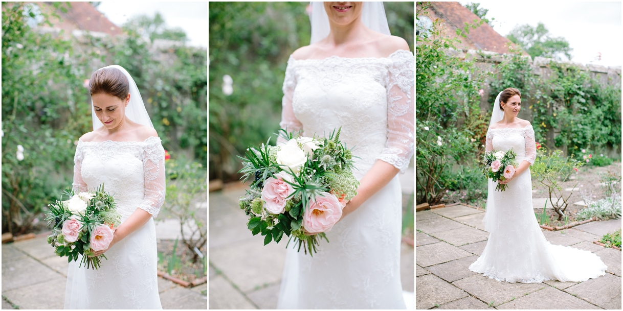Bride holding pink and white bouquet at Chiddingstone Castle