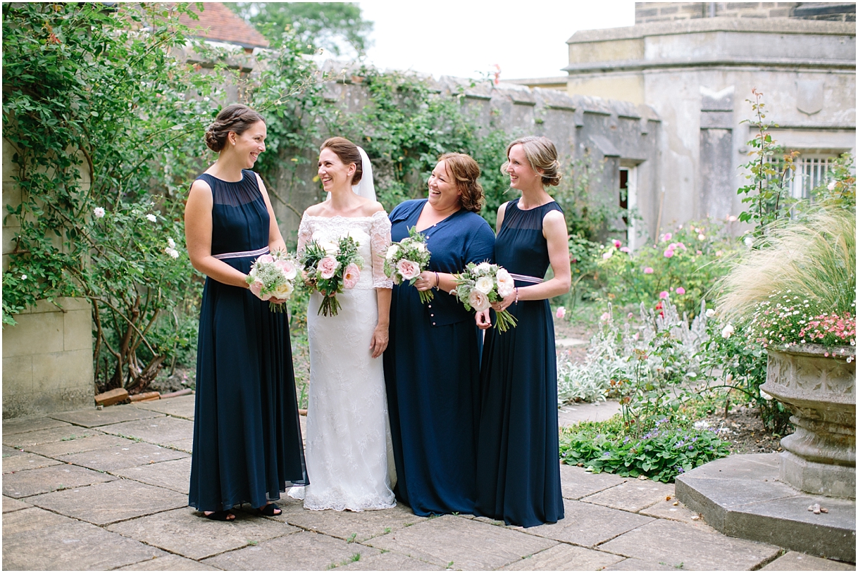 Bride with bridesmaids in navy dresses