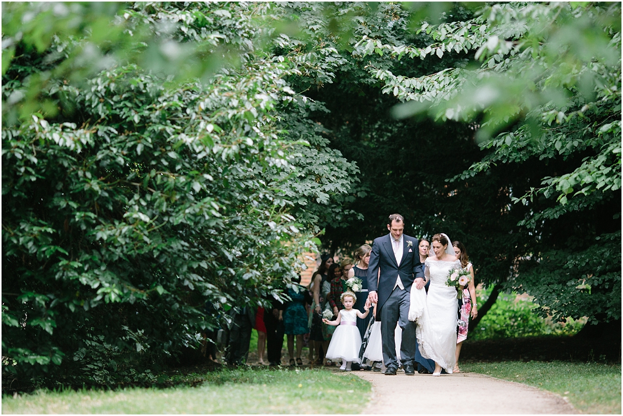 Bridal party walking to Chiddingstone Castle