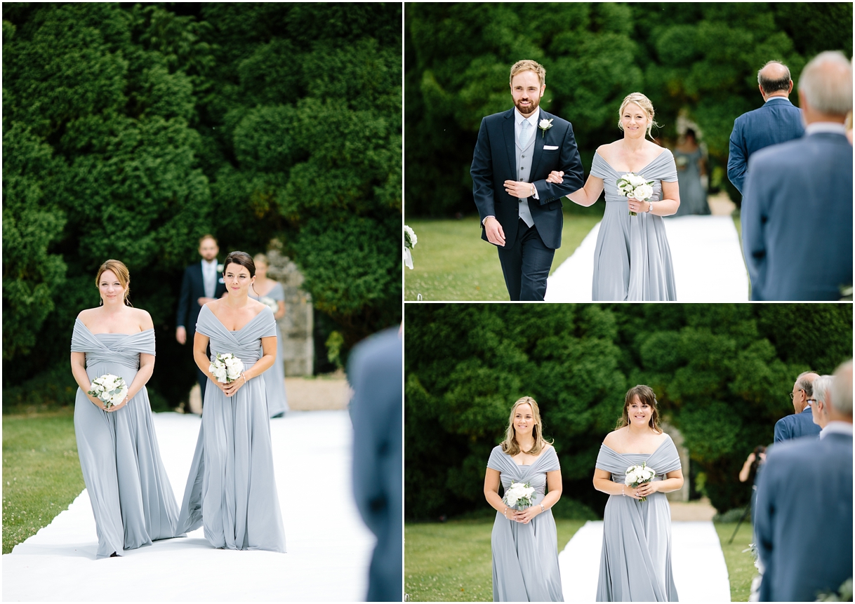 Bridesmaids walking down aisle at outdoor ceremony at Notely Abbey