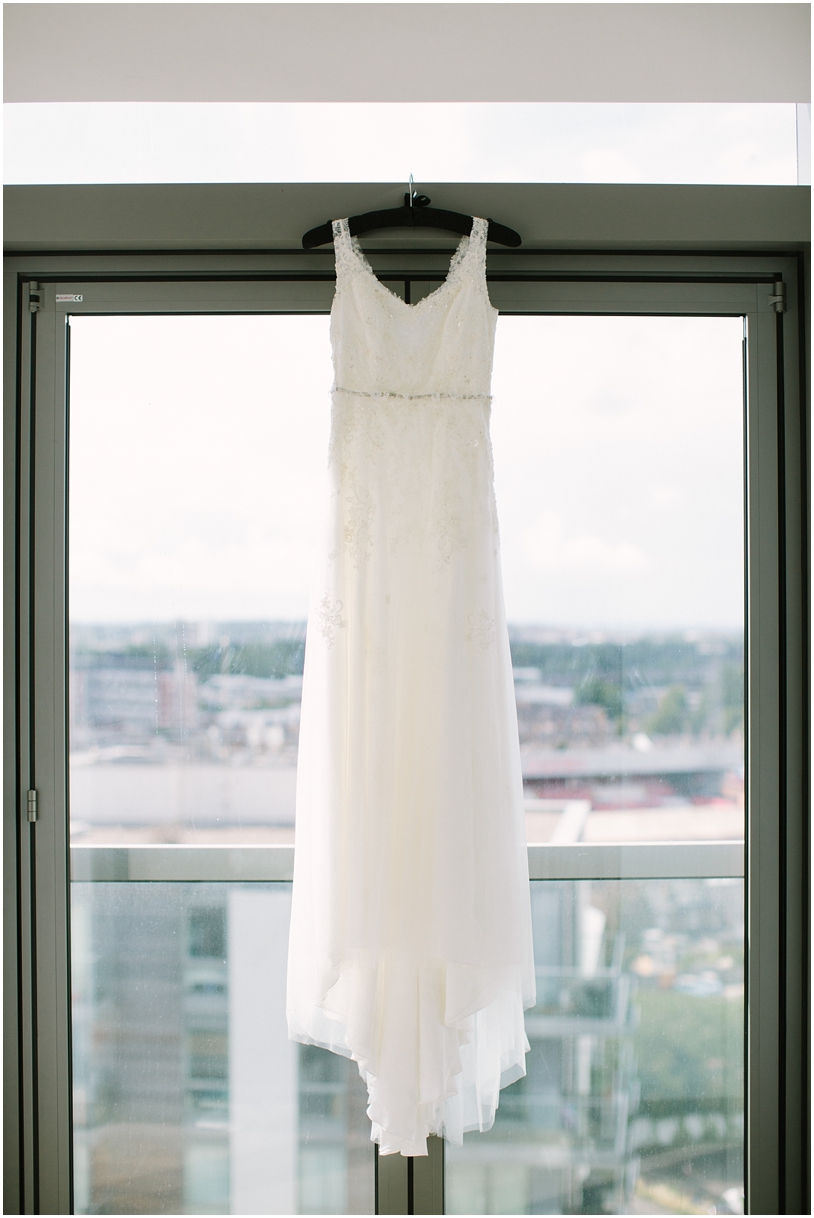 Charlotte Wilden wedding dress hanging in window