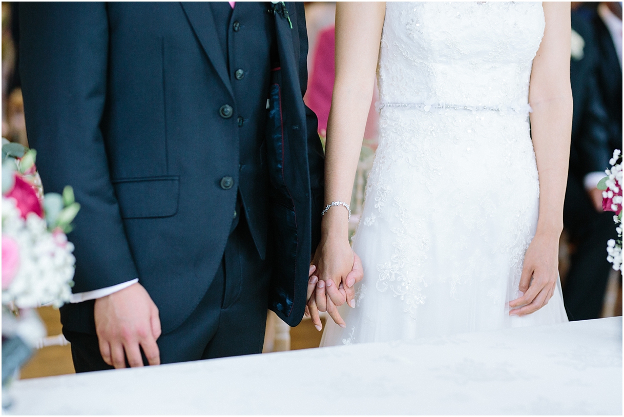 Bride and groom holing hands