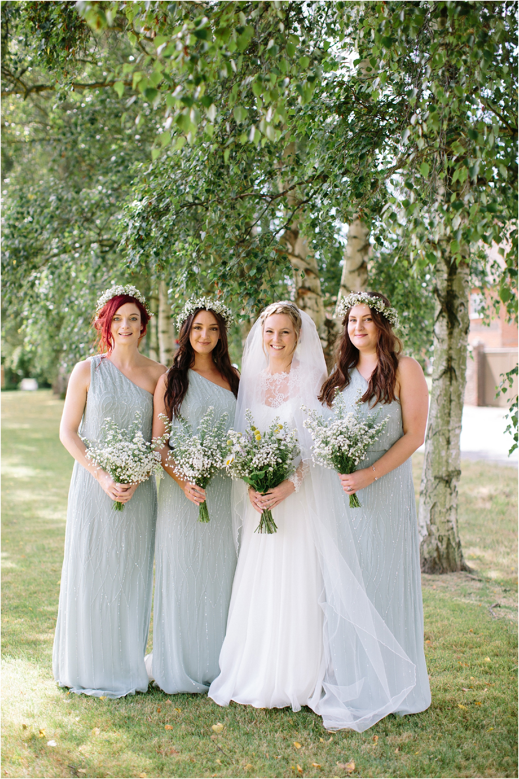 Bridesmaids in mint green beaded dresses