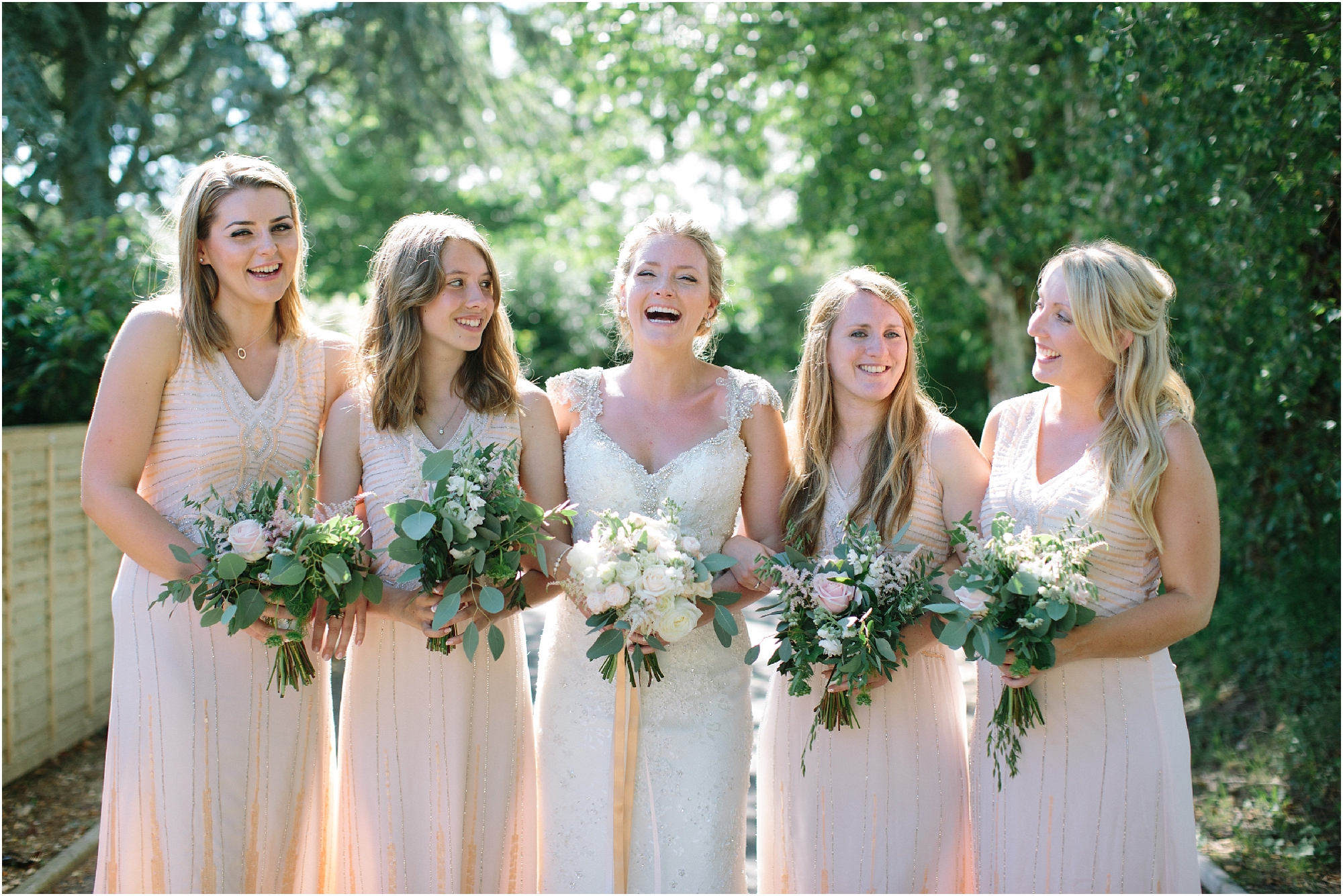 Bridesmaids in peach dresses