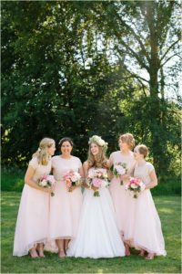 Bridesmaids in blush two piece dresses