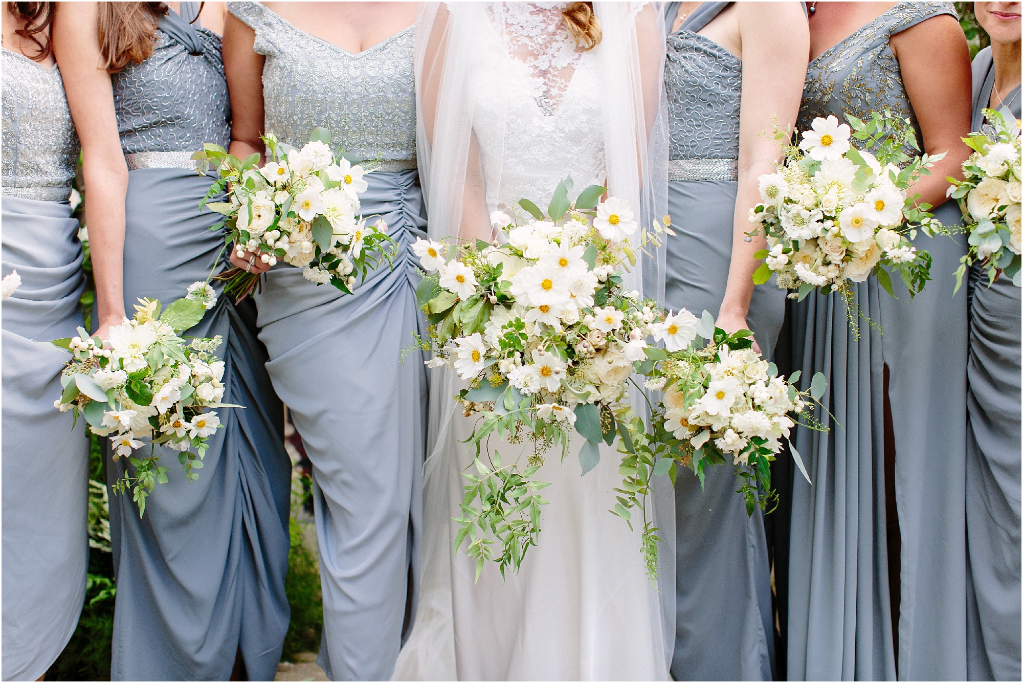 Bridesmaids in blue miss matched dresses 