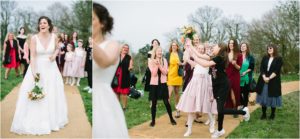bride throwing bouquet