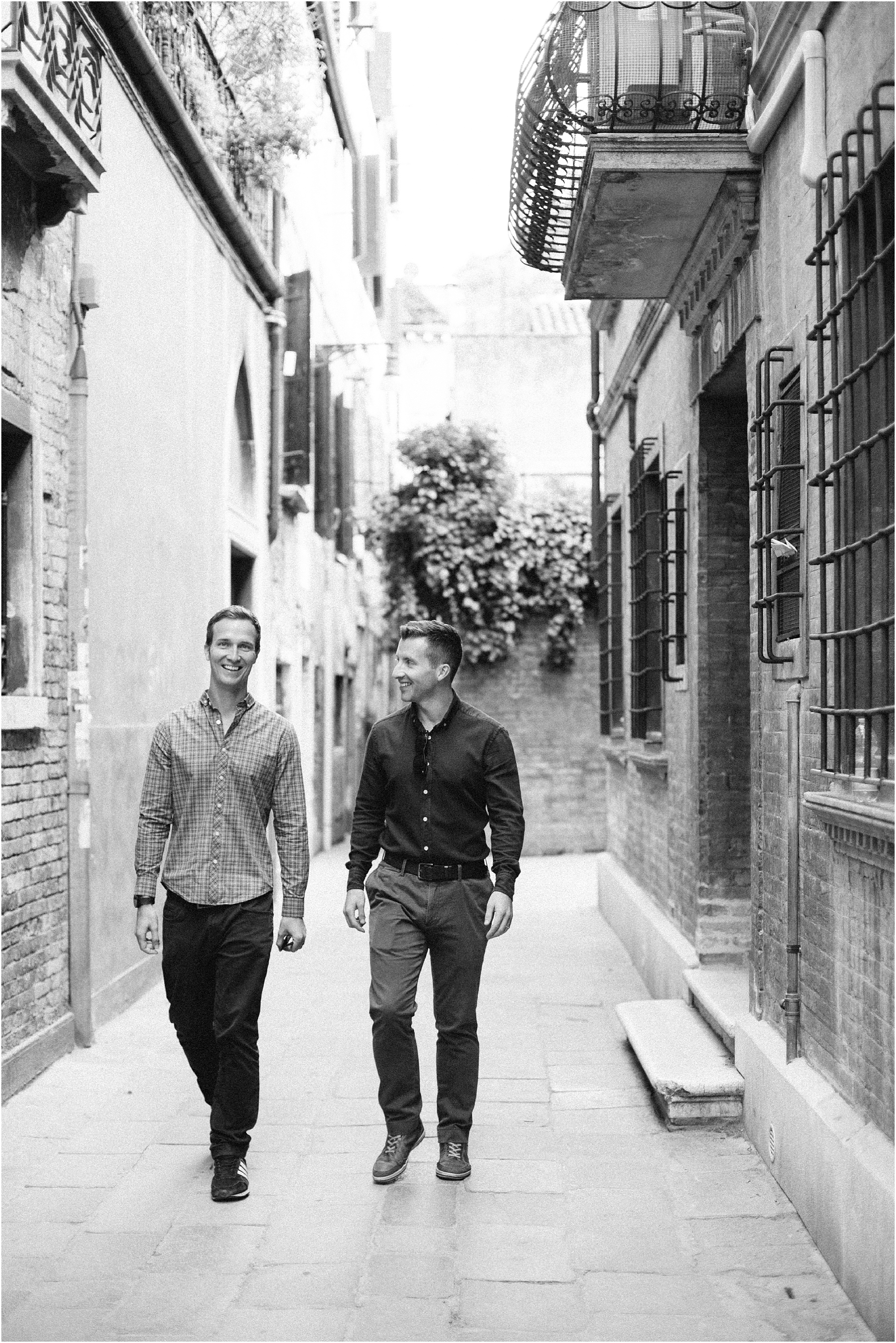 Male couple walking in Venice Italy