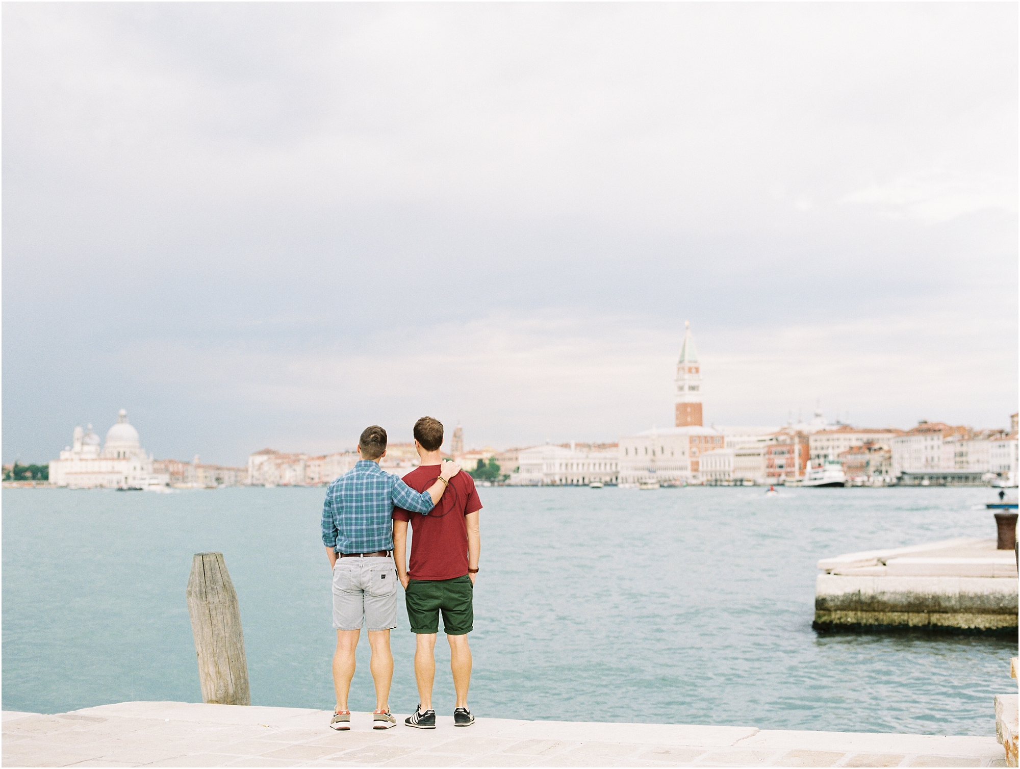 Gay couple looking out over Venice Italy