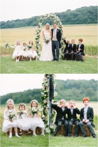 Bridal party under flower arch