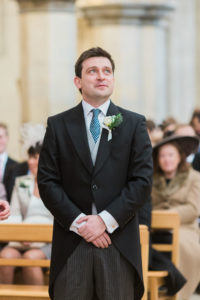Groom waiting for bride at the alter of Boxgrove Priory wedding