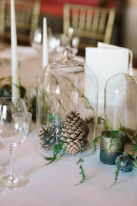 Pinecones under glass cover on the table of Goodwood House wedding