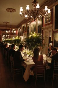 Candle lit wedding breakfast during Goodwood House wedding