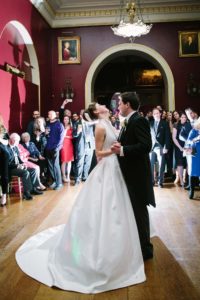 Bride and groom performing their first dance at Goodwood House