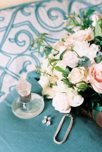 Classic and elegant bridal style. Rose bouquet, wedding perfume and diamond jewellery