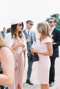 Wedding guests mingling at Stansted House