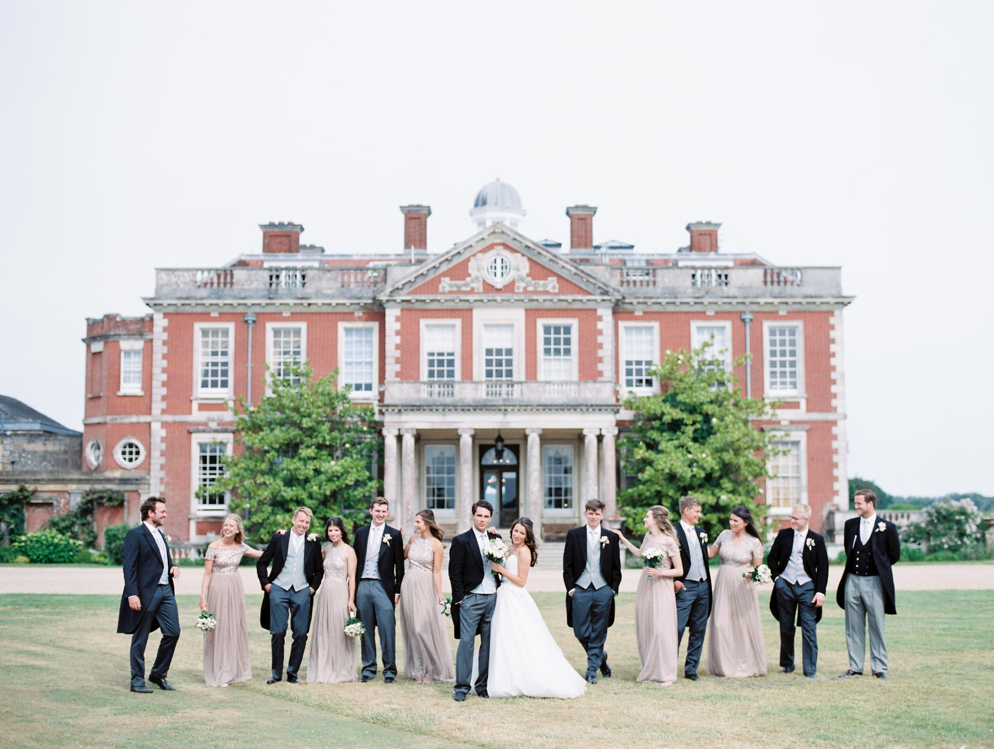 Bridal party standing outside Stansted House