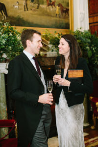 Couple talking during wedding reception at Goodwood House