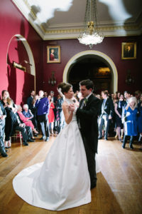 Bride and groom performing first dance at Goodwood House
