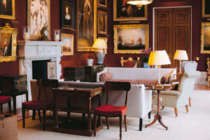 Wide photograph of the music room at Goodwood House in West Sussex