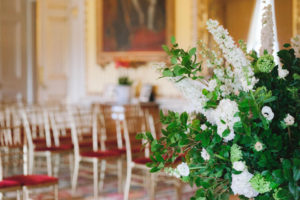 Yellow drawing room at Goodwood House during wedding ceremony