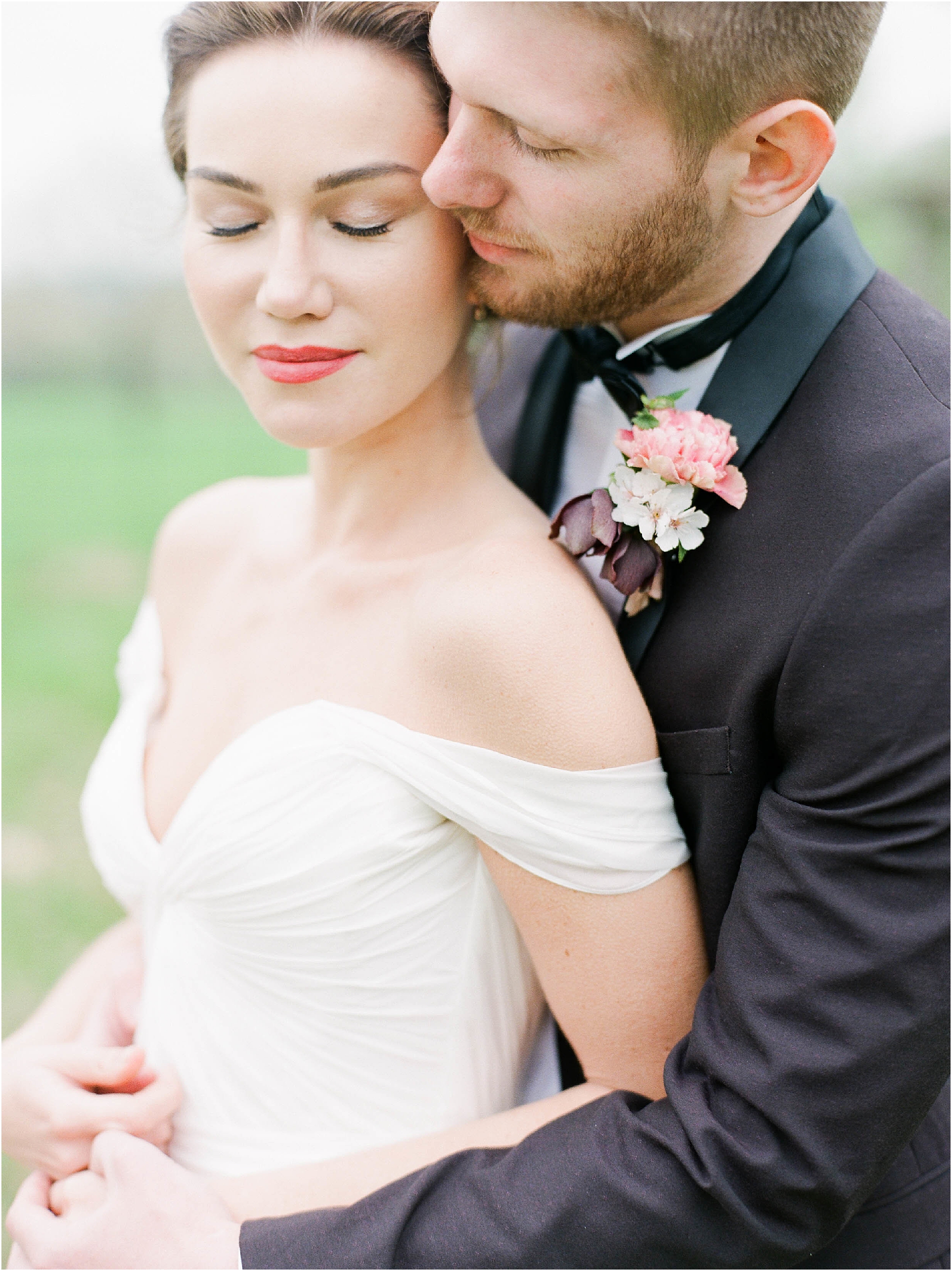 Bride and Groom in tender embrace by film wedding photographer Camilla Arnhold