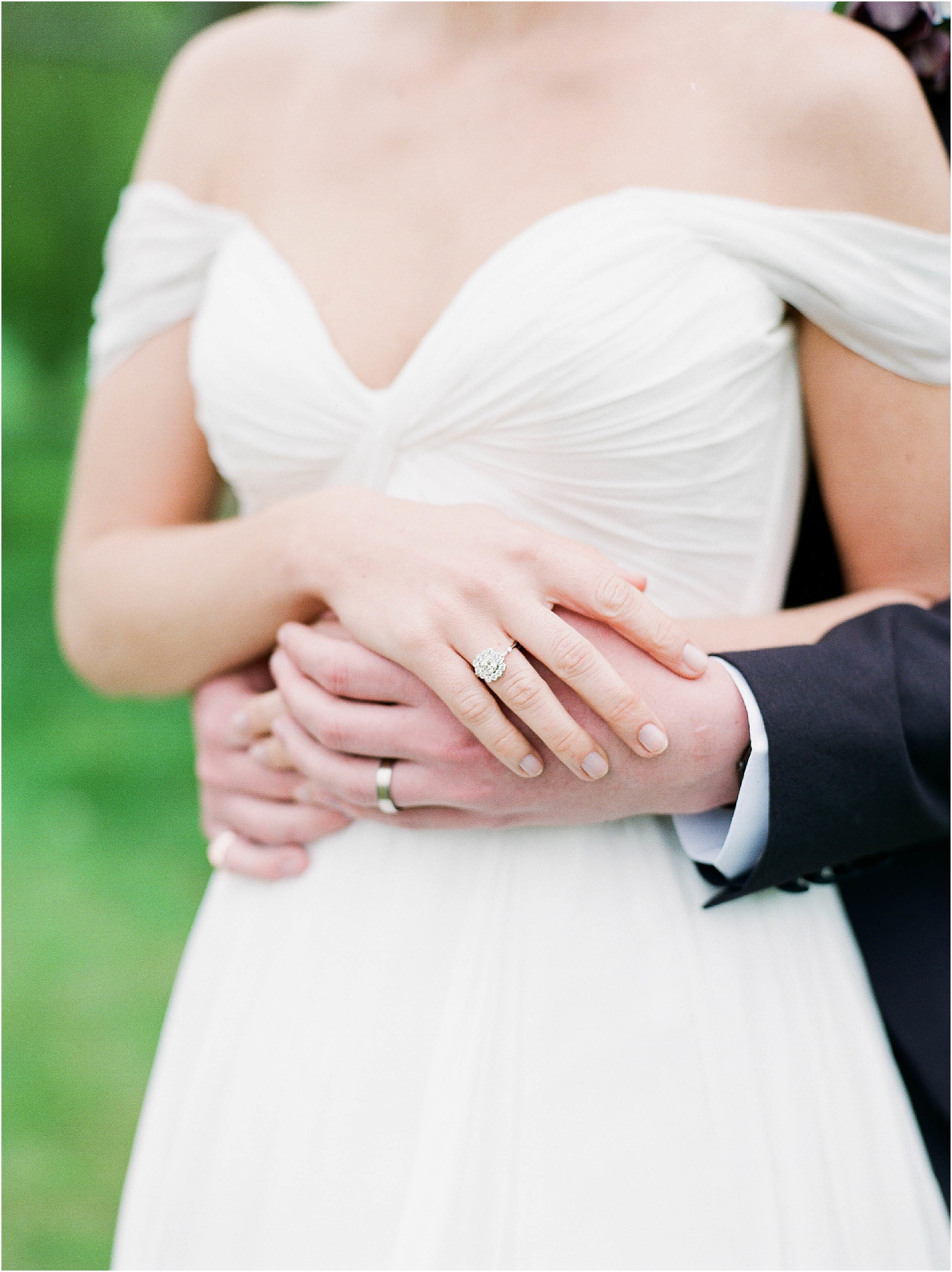 Wedding and engagement rings on bride and groom