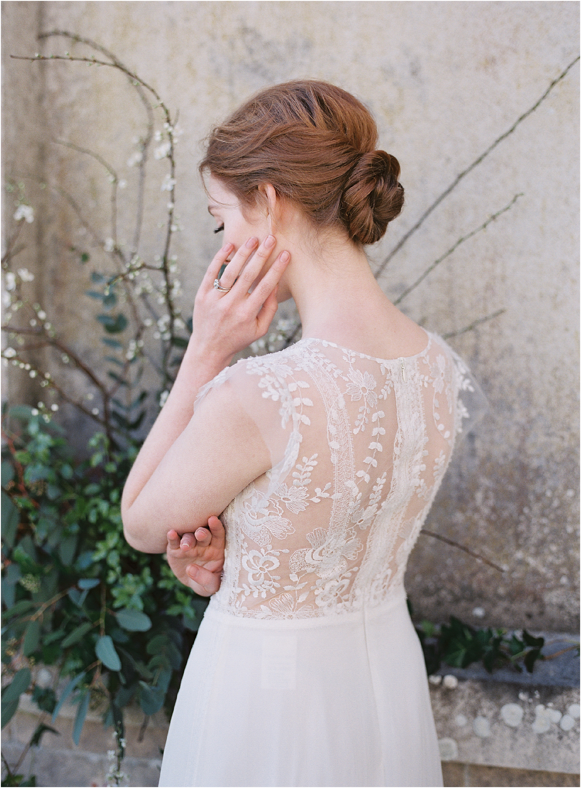 Romantic ed haired bride with lace wedding dress