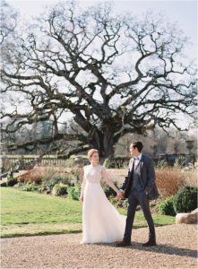Wedding couple walking in the grounds of Somerley House