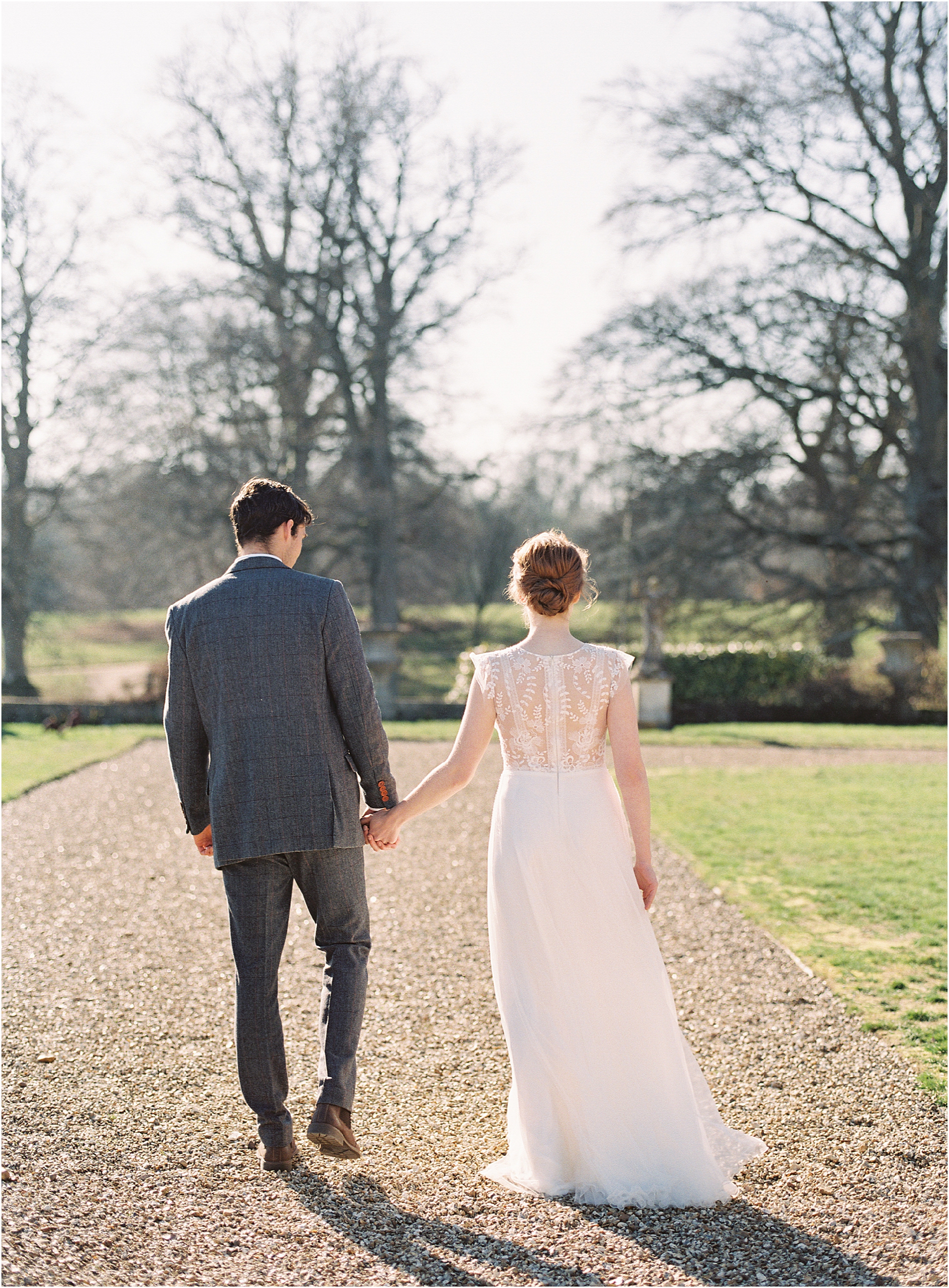 Wedding couple walking in the grounds of Somerley House