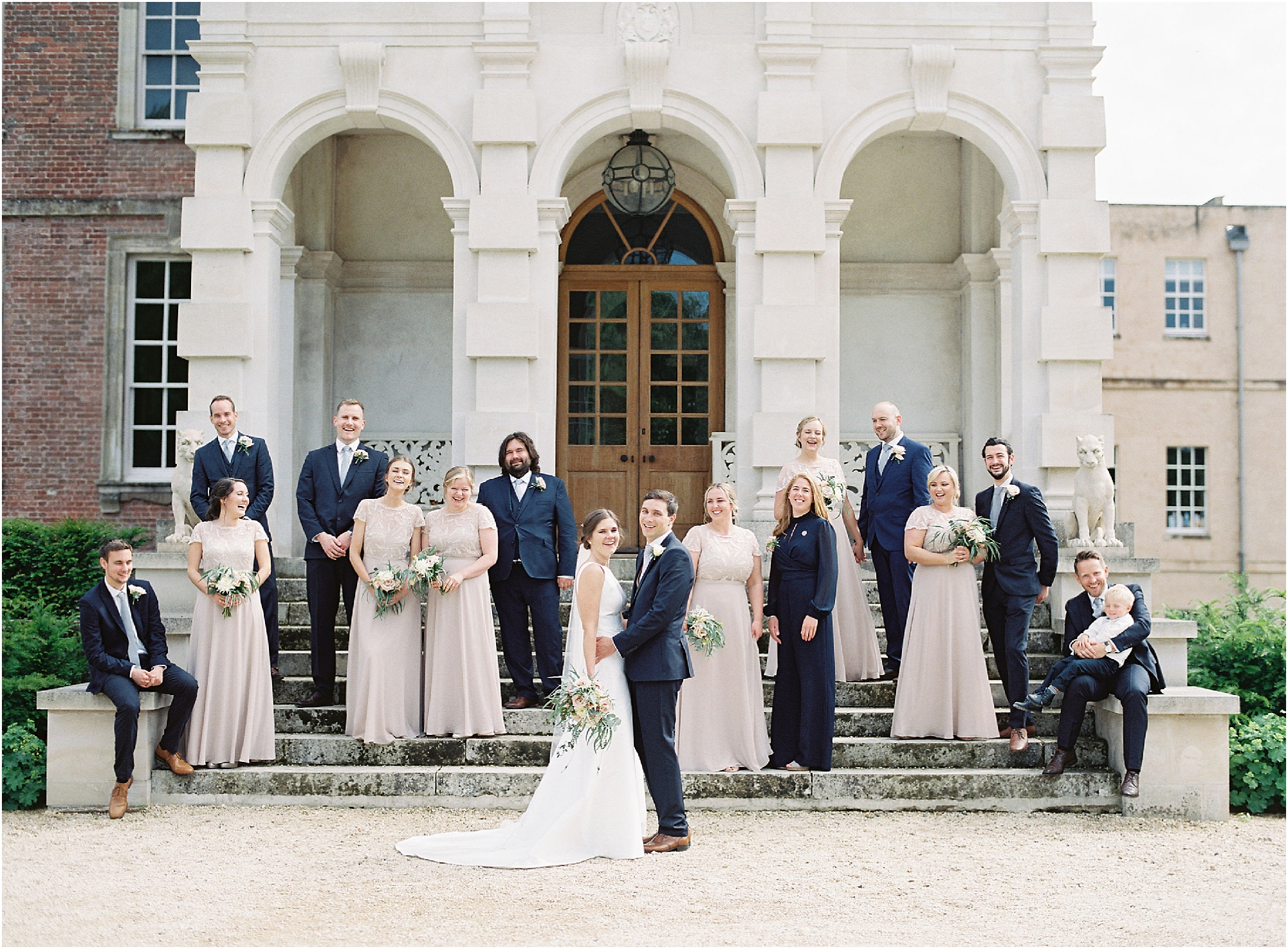 Relaxed bridal party photograph at St Giles House Dorset