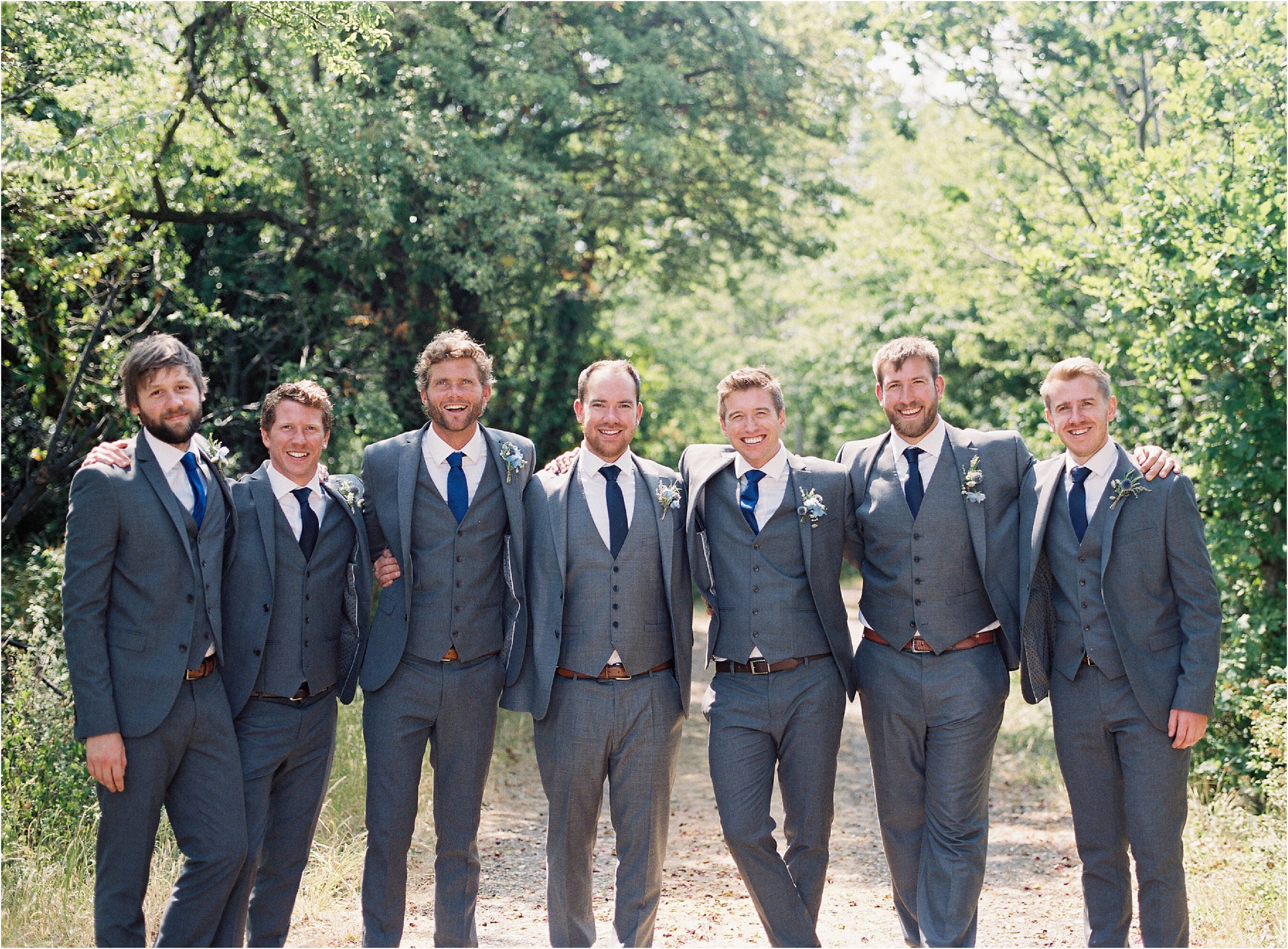 groom with ushers posing for a casual wedding group photo