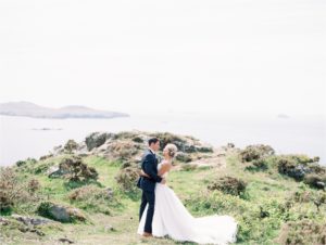 Romantic wedding portrait on cliff top
