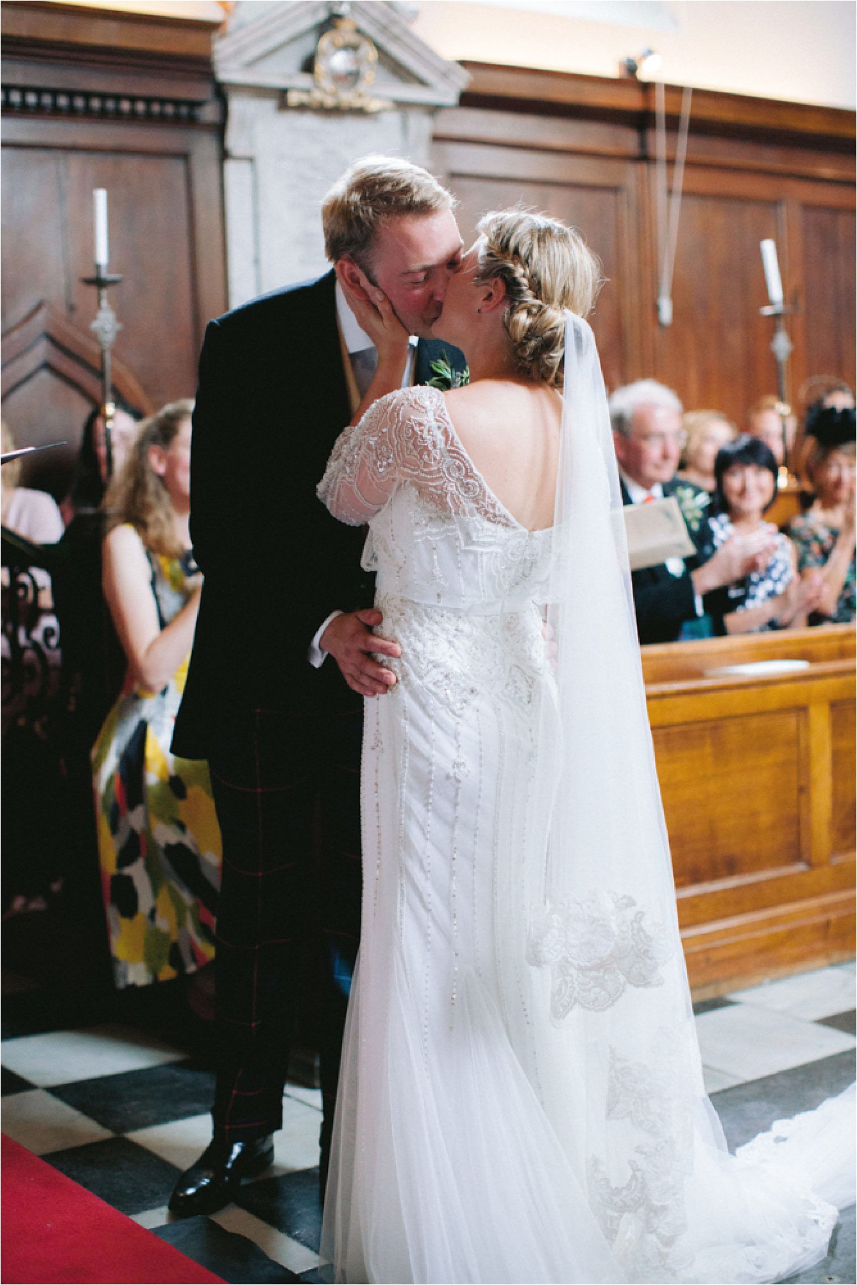 first kiss in the chapel at Trinity Hall Cambridge wedding