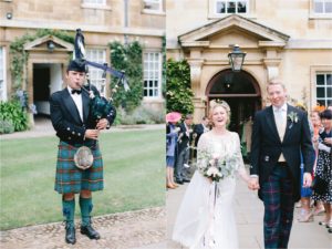 bride and groom with bagpipe player at elegant English wedding