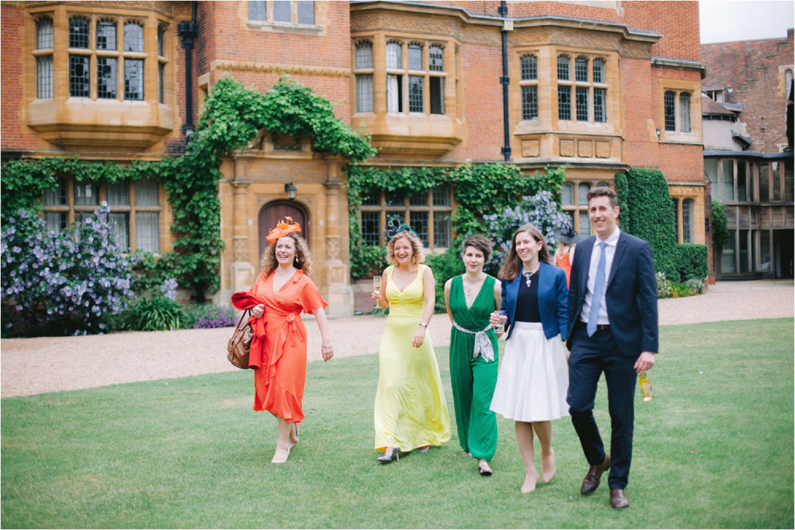 guests walking on the lawn at Trinity hall Cambridge