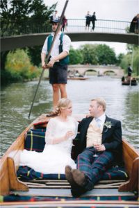 bride and groom on a punt at Cambridge University