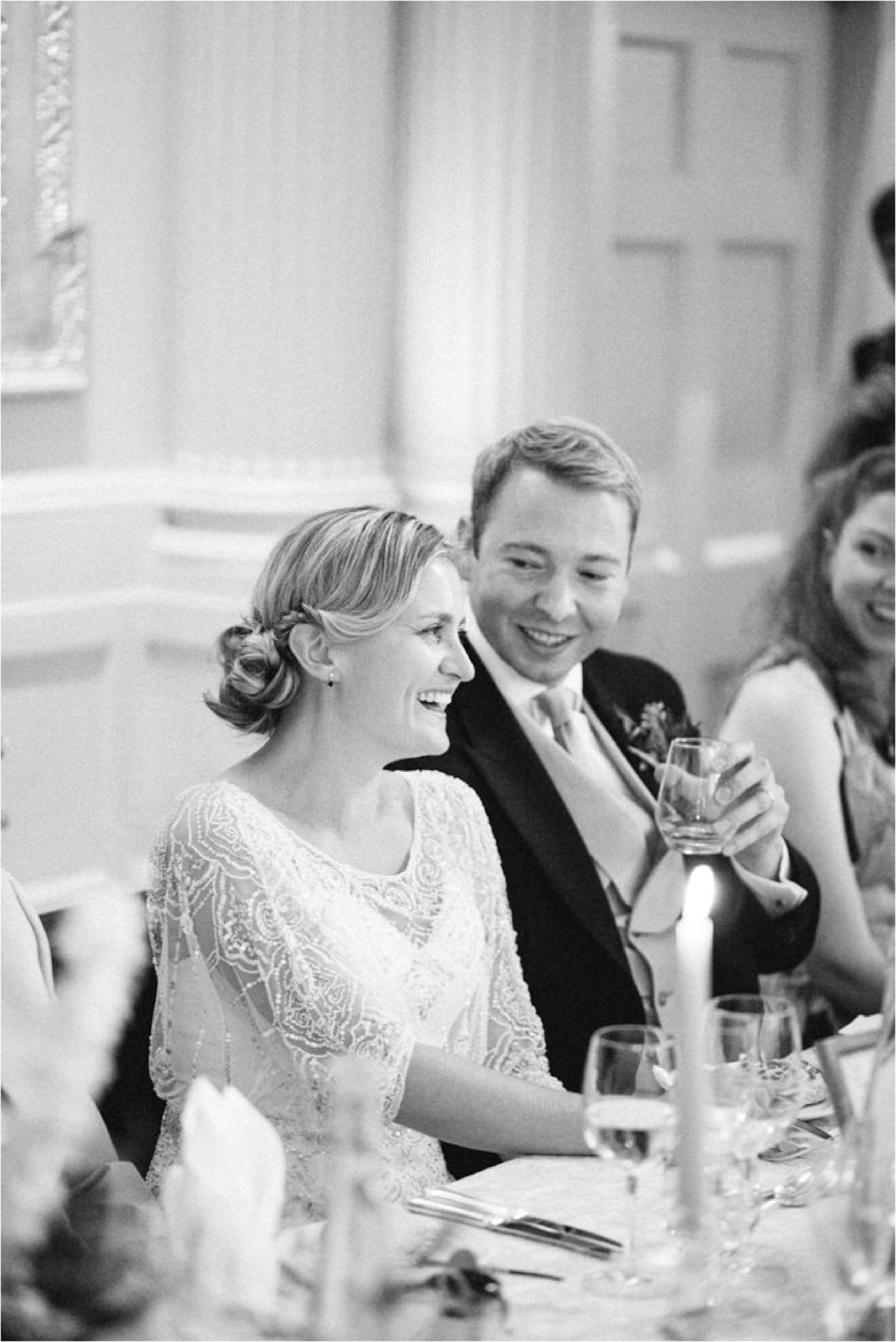groom toasting bride during wedding speeches