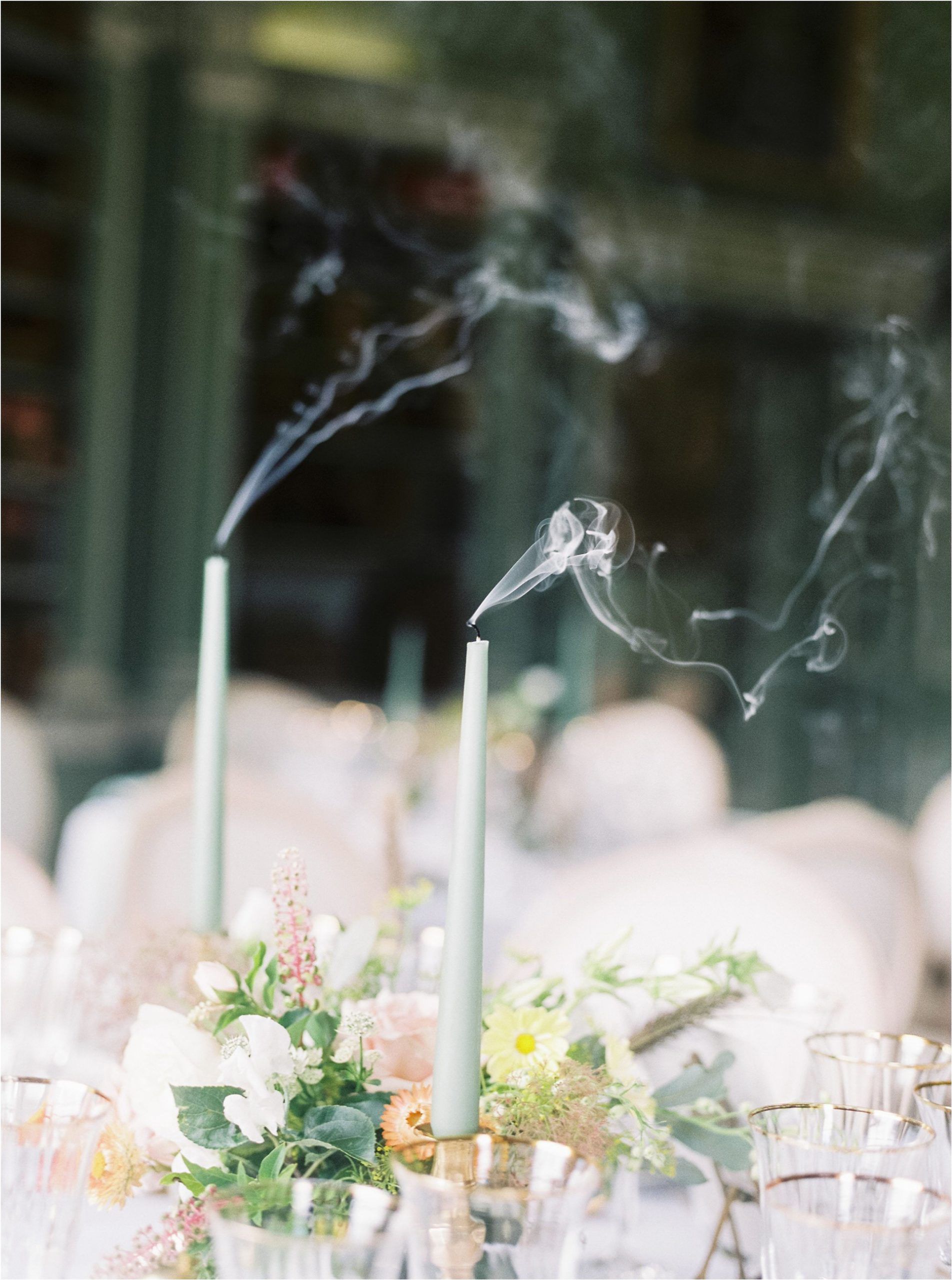 smoking candles on wedding breakfast table
