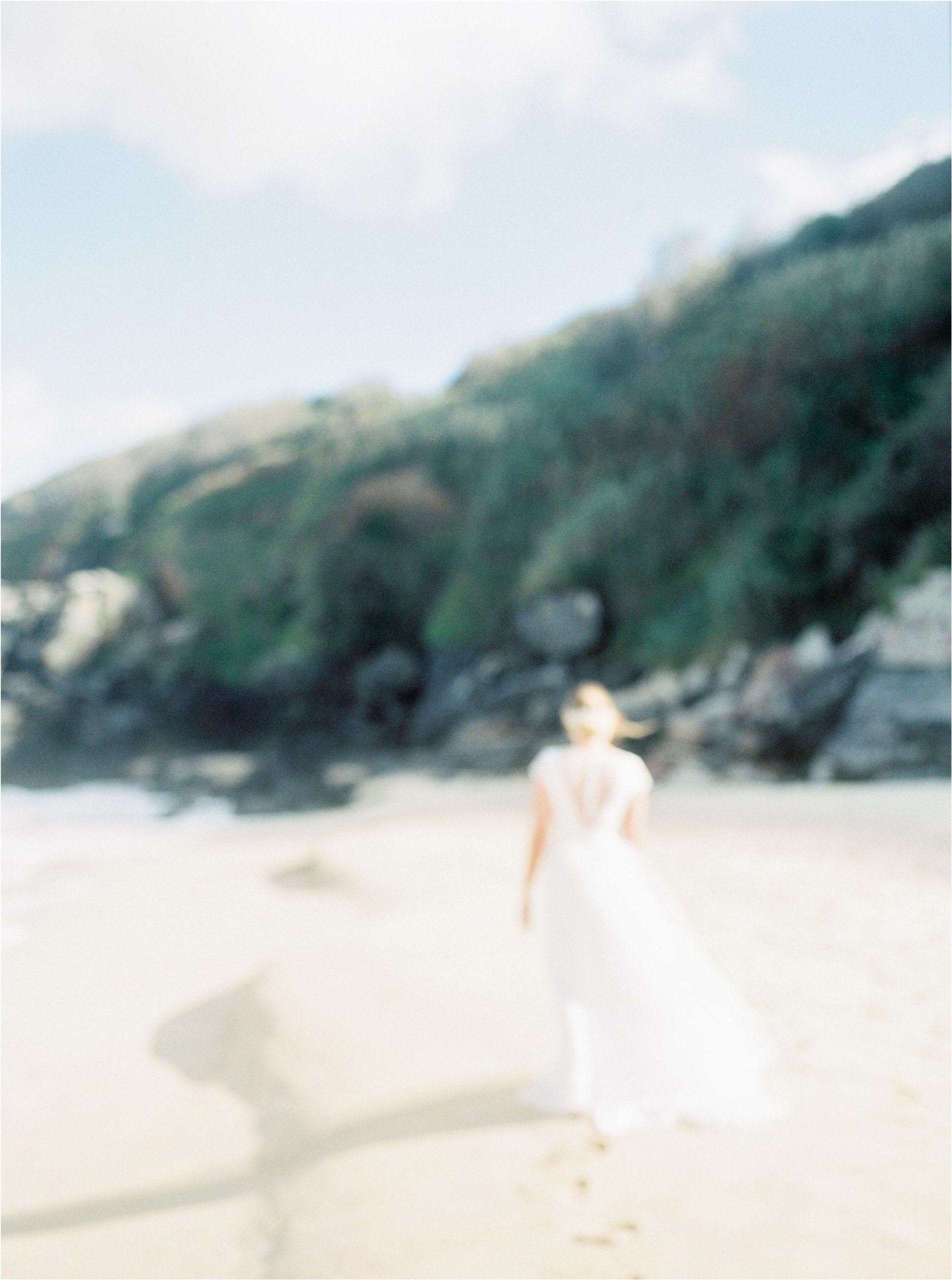 bride walking away on beach