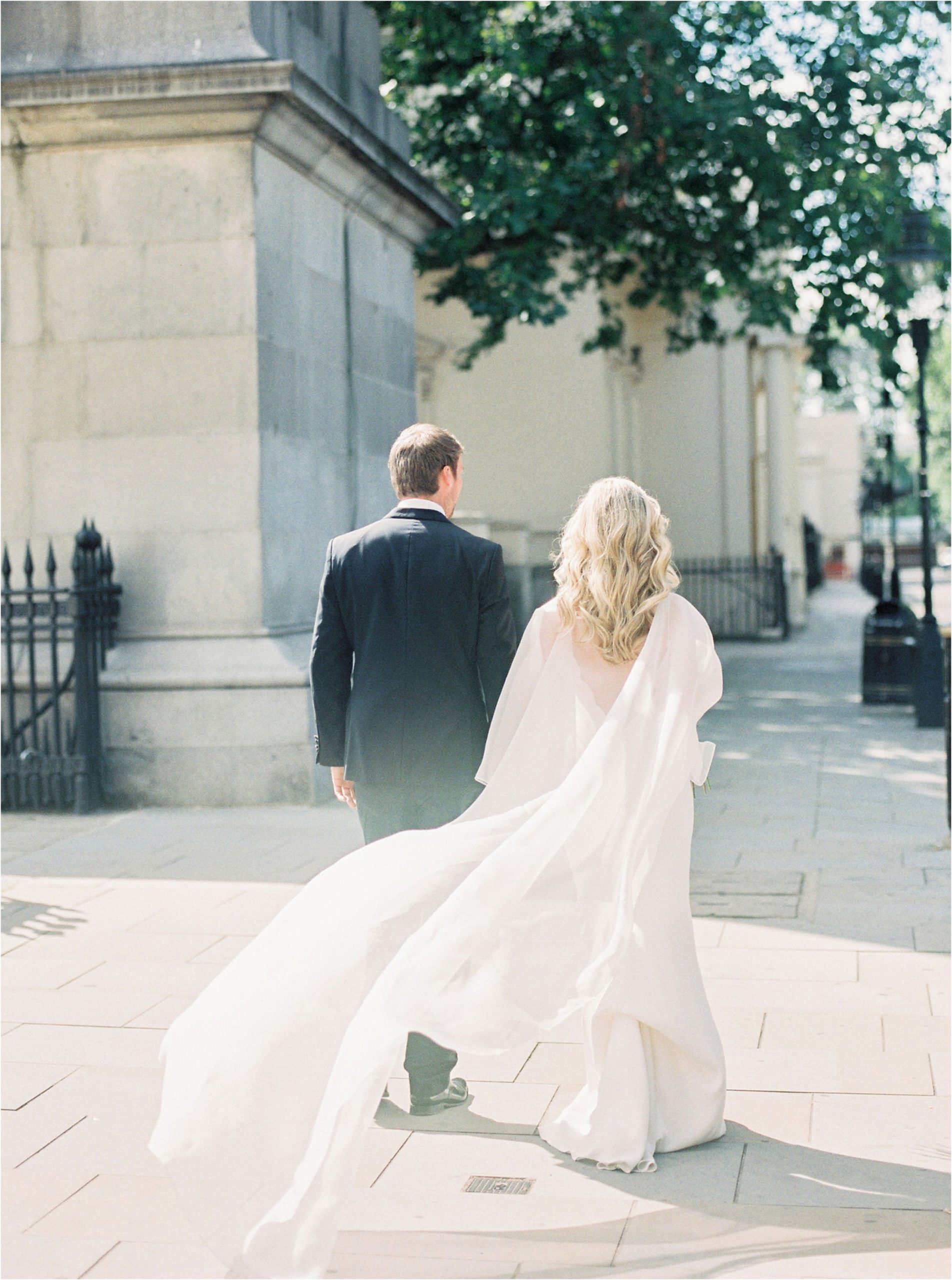 Bride and groom walking away at 10-11 Carlton House Terrace wedding