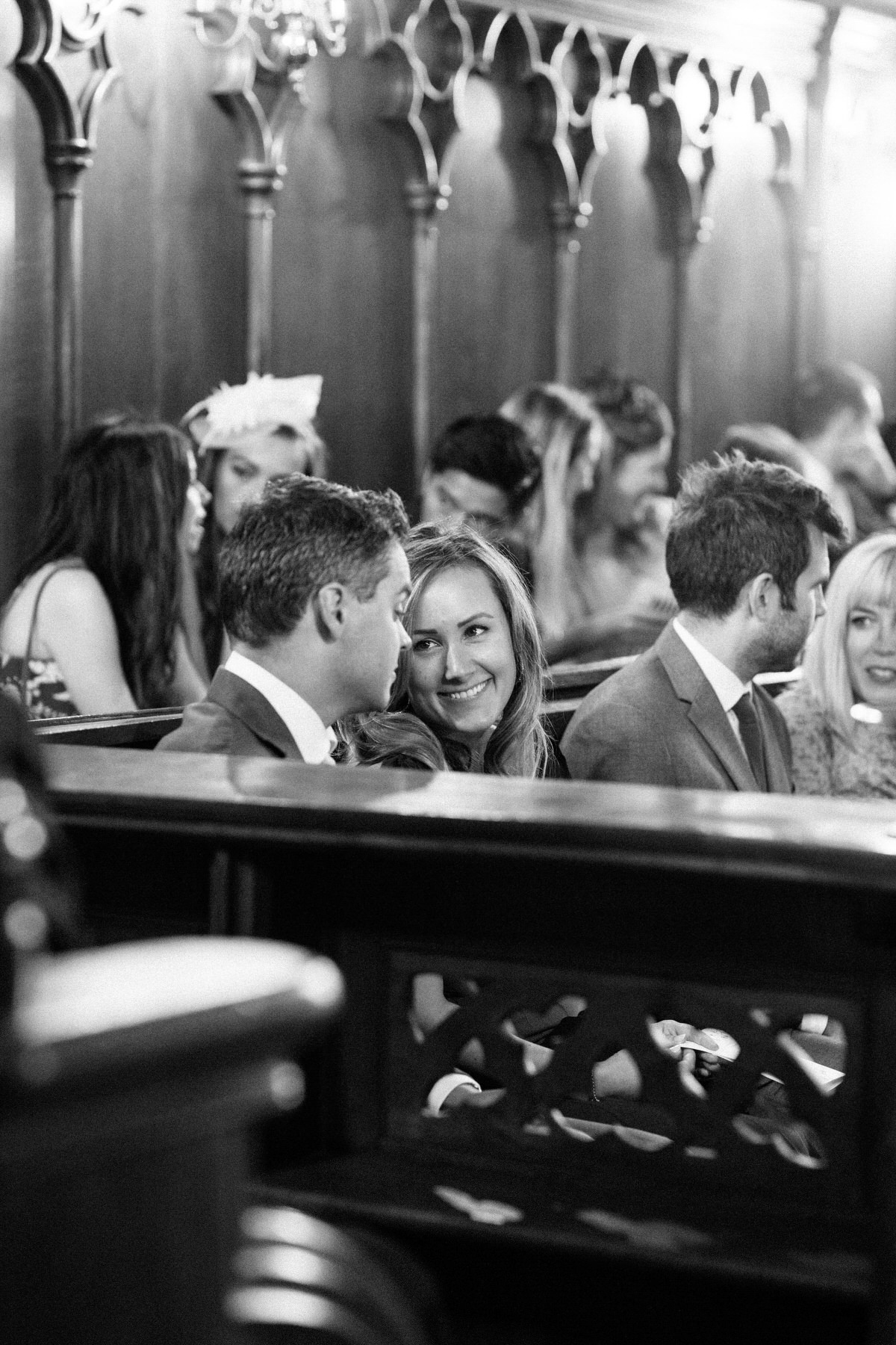 guests smiling in church wedding