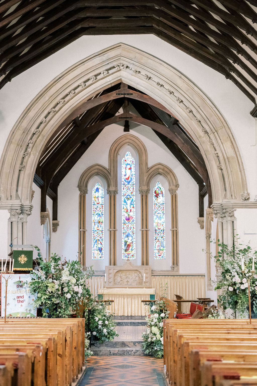 green and white florals in church wedding