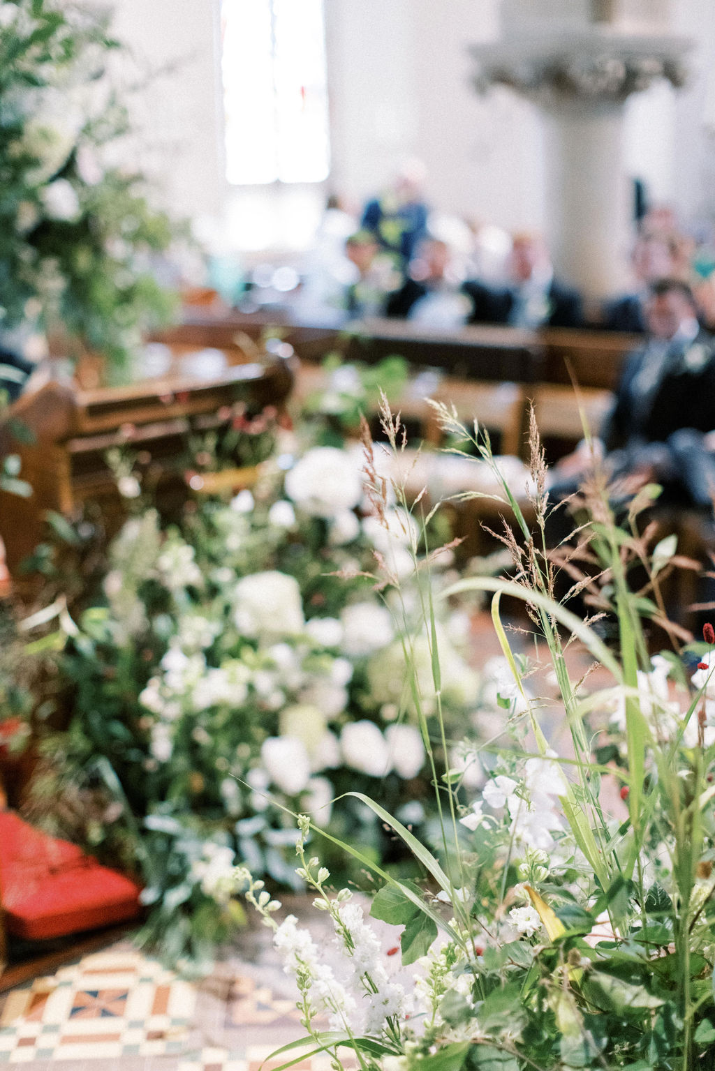 Summer floral display with grass in church wedding