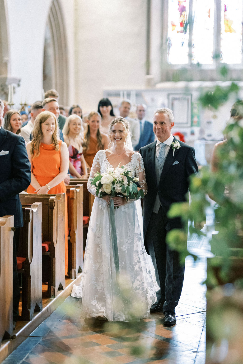 Father of the bride walking bride into church