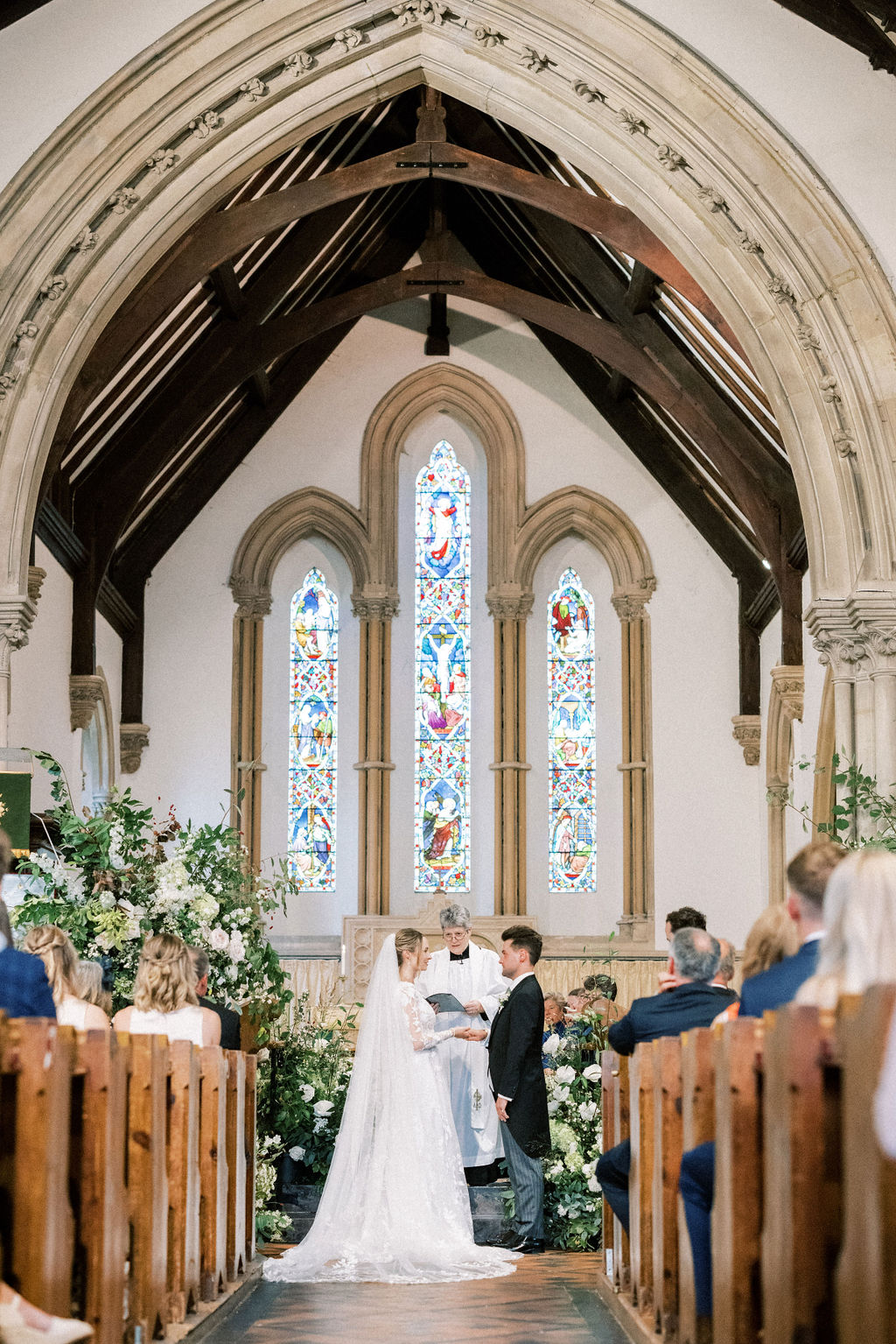 Bride and groom in church wedding by fine art wedding photographer Camilla Arnhold