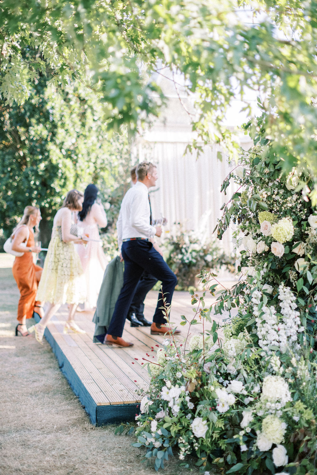 guests entering marquee at English garden marquee wedding