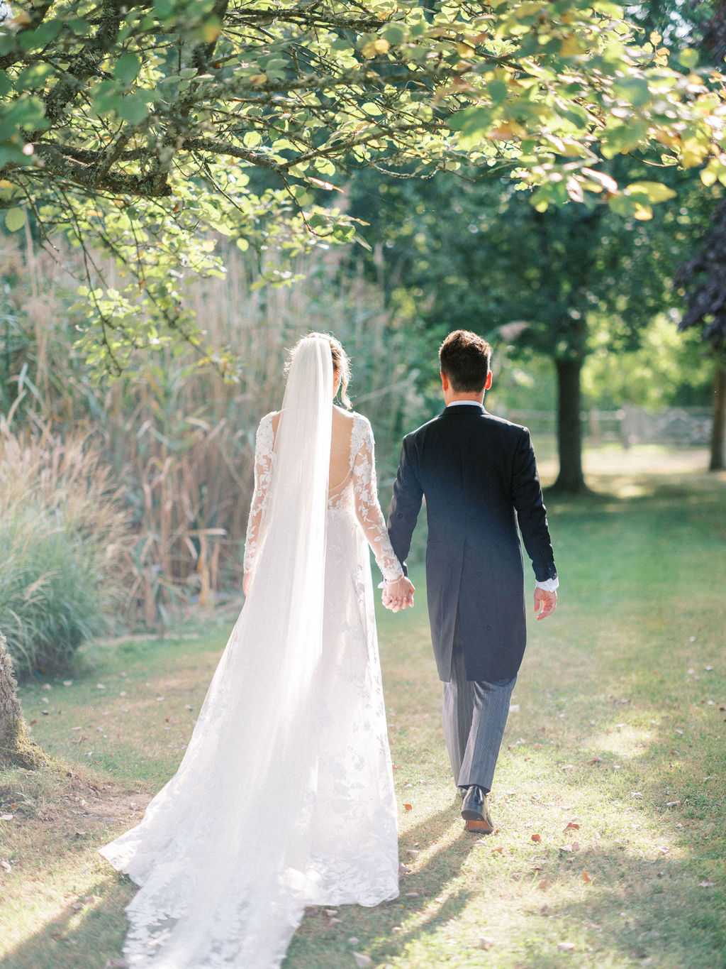 Bride and groom at garden marquee wedding