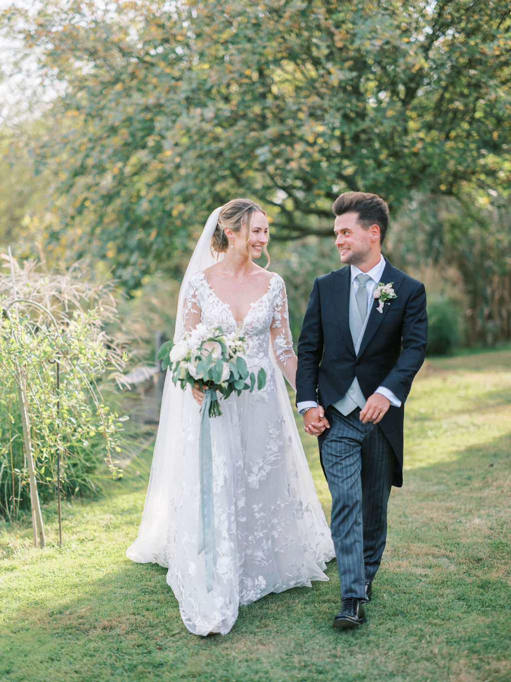 Bride and groom at garden marquee wedding